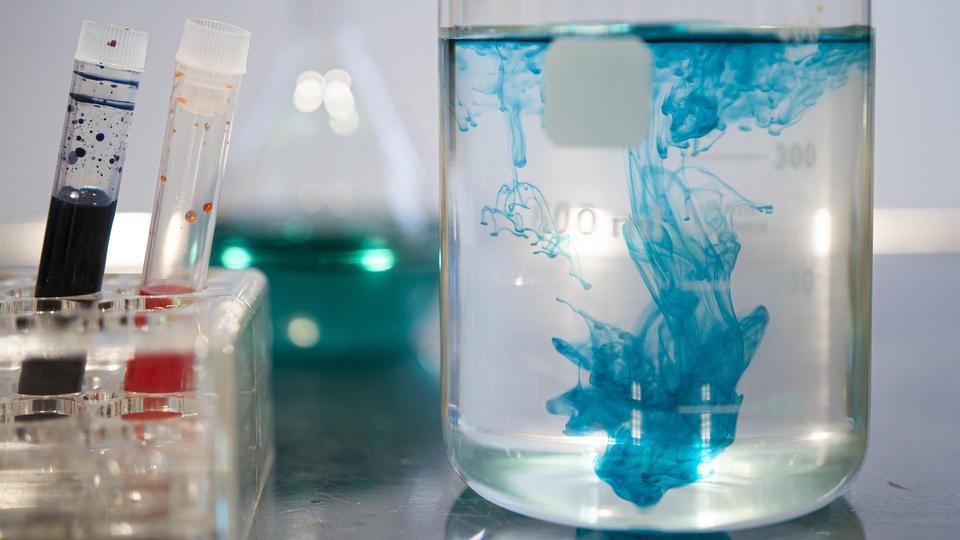 Blue liquid in glass containers